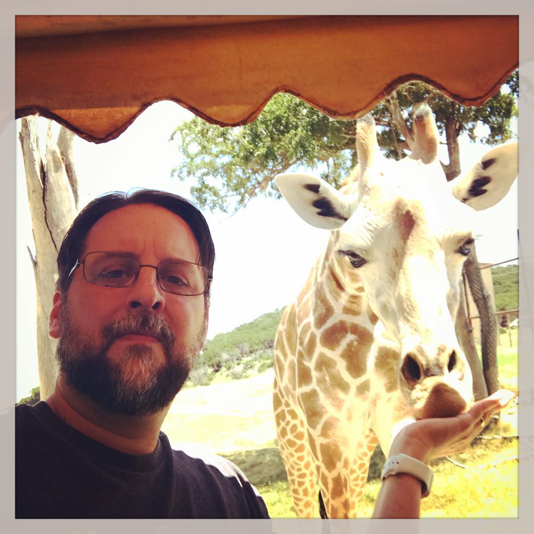 Feeding giraffe selfie at Fossil Rim.